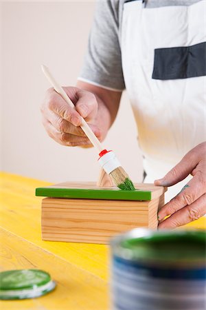 paintbrush - Man Painting Woodworking Project in Studio Stock Photo - Premium Royalty-Free, Code: 600-06645771