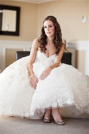 strapless wedding gown - Portrait of Bride sitting in Hotel Room Stock Photo - Premium Royalty-Free, Code: 600-06669614