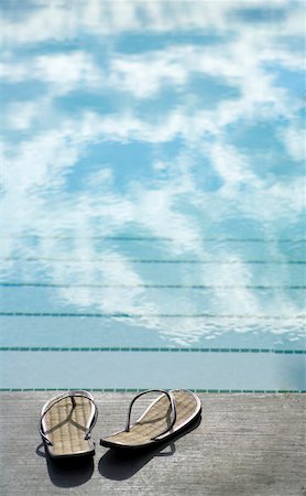 swimmingpool without people - Sandals on the edge of swimming pool, Okanagan Valley, British Columbia, Canada Stock Photo - Premium Royalty-Free, Code: 600-06674972