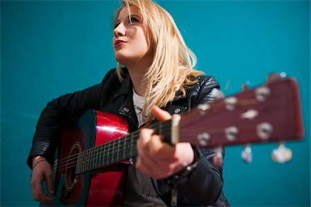 simsearch:600-06701796,k - Woman Playing Acoustic Guitar Stock Photo - Premium Royalty-Free, Code: 600-06675152