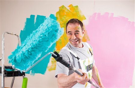 renovar - Portrait of Mature Man with Paint Roller Renovating his Home Foto de stock - Sin royalties Premium, Código: 600-06679393