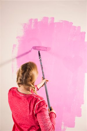 simsearch:600-06671767,k - Studio Shot of Young Woman Painting Wall Pink Stock Photo - Premium Royalty-Free, Code: 600-06671788