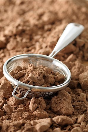 food ingredients still life - Close-up of Cocoa Powder in Sieve Stock Photo - Premium Royalty-Free, Code: 600-06671825