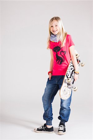 preteen portraits - Full Length Portrait of Girl with Skateboard in Studio Stock Photo - Premium Royalty-Free, Code: 600-06685182