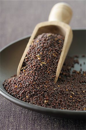 Close-up of Bowl of Mustard Seeds with Scoop, Studio Shot Stock Photo - Premium Royalty-Free, Code: 600-06702120