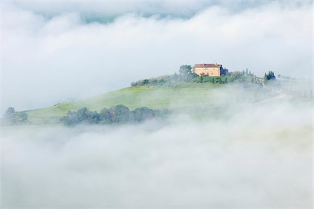 farmhouse - Typical Tuscany landscape with farm in morning with fog near Pienza. Pienza, Siena district, Tuscany, Toscana, Italy. Stock Photo - Premium Royalty-Free, Code: 600-06732597