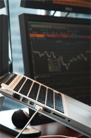 Close-up of Laptop Computer and Computer Monitors in Office Stock Photo - Premium Royalty-Free, Code: 600-06758104