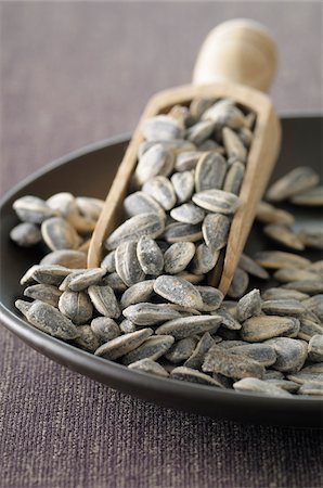 seed - Close-up of Bowl of Sunflower Seeds with Scoop, Studio Shot Stock Photo - Premium Royalty-Free, Code: 600-06752242