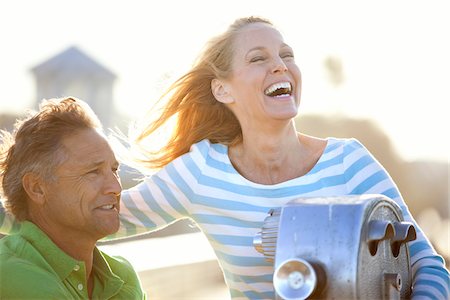 seniors sea - Mature Couple being Playful by Scenic Viewer on Pier, USA Stock Photo - Premium Royalty-Free, Code: 600-06752302