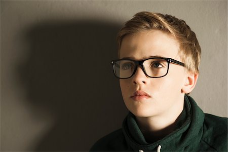 Head and Shoulders Portrait of Boy, Studio Shot Stock Photo - Premium Royalty-Free, Code: 600-06752467