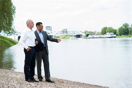 radius images - Businessmen Standing by River, Mannheim, Baden-Wurttemberg, Germany Stock Photo - Premium Royalty-Free, Code: 600-06773353
