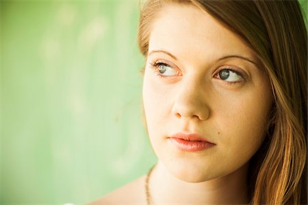 Close-up portrait of young woman outdoors Stock Photo - Premium Royalty-Free, Code: 600-06786775