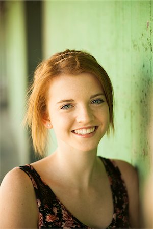 Portrait of teenage girl outdoors, smiling at camera Stock Photo - Premium Royalty-Free, Code: 600-06786771