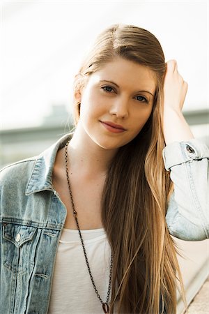 simsearch:700-07278966,k - Portrait of young woman outdoors, looking at camera Stock Photo - Premium Royalty-Free, Code: 600-06786796