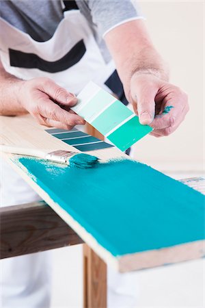 Close-up of Senior Man Comparing Paint Sample to Painted Board, Studio Shot Stock Photo - Premium Royalty-Free, Code: 600-06787008