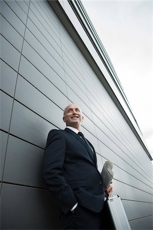 simsearch:600-07148346,k - Portrait of businessman leaning against wall of building, Mannheim, Germany Foto de stock - Sin royalties Premium, Código: 600-06782187