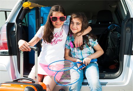 family packing car for vacation - Portrait of Sisters in Trunk of Van Getting ready for Vacation, Mannheim, Baden-Wurttemberg, Germany Stock Photo - Premium Royalty-Free, Code: 600-06808920