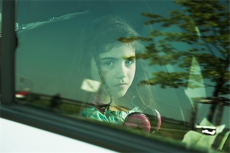 sad girl photos - Girl in Minivan through Window, Mannheim, Baden- Wurttemberg, Germany Stock Photo - Premium Royalty-Free, Code: 600-06808922