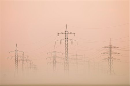 power pylons - Power lines in early morning fog, Hesse, Germany, Europe Stock Photo - Premium Royalty-Free, Code: 600-06803845