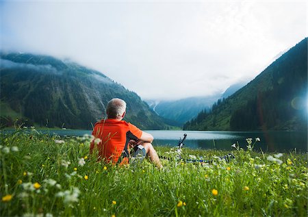 simsearch:6115-07109843,k - Mature Man with Mountain Bike sitting by Lake, Vilsalpsee, Tannheim Valley, Tyrol, Austria Stock Photo - Premium Royalty-Free, Code: 600-06819416