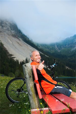 Mature Man on Bench by Lake with Mountain Bike, Vilsalpsee, Tannheim Valley, Tyrol, Austria Stock Photo - Premium Royalty-Free, Code: 600-06819425