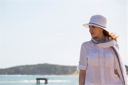 sun hat - Woman Walking on Beach, Sardinia, Italy Stock Photo - Premium Royalty-Free, Code: 600-06819440