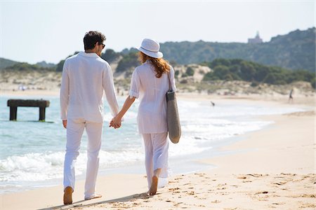 european adult beach photos - Back View of Couple Walking on Beach, Sardinia, Italy Stock Photo - Premium Royalty-Free, Code: 600-06826333