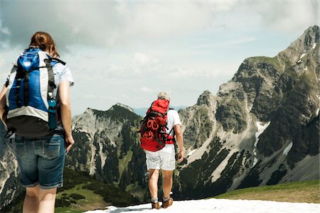 simsearch:600-06841943,k - Backview of mature couple hiking in mountains, Tannheim Valley, Austria Stock Photo - Premium Royalty-Free, Code: 600-06826349