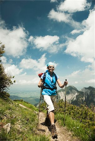 pole - Mature woman hiking in mountains, Tannheim Valley, Austria Stock Photo - Premium Royalty-Free, Code: 600-06826359
