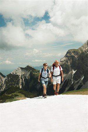 Mature couple hiking in mountains, Tannheim Valley, Austria Stock Photo - Premium Royalty-Free, Code: 600-06826350