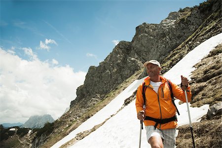 simsearch:600-06841771,k - Mature man hiking in mountains, Tannheim Valley, Austria Stock Photo - Premium Royalty-Free, Code: 600-06826363