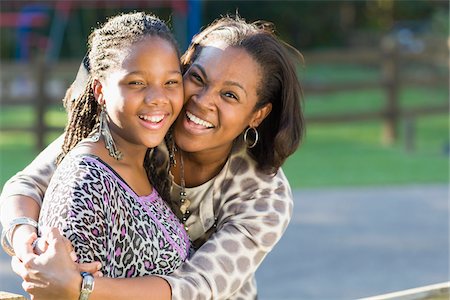 fashion of black people - Portrait of pre-teen girl and mother, hugging outdoors Stock Photo - Premium Royalty-Free, Code: 600-06847435