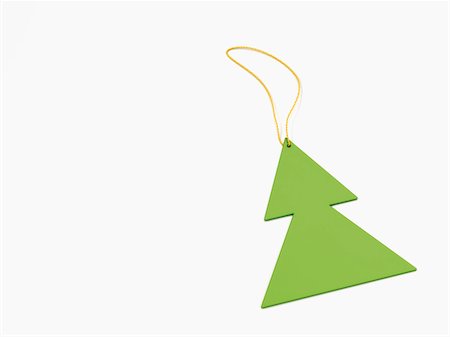 Green Christmas tree shaped decoration on white background Foto de stock - Sin royalties Premium, Código: 600-06841667