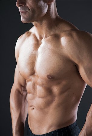 simsearch:600-07278953,k - Close-up of Muscular Man's Chest, Studio Shot Foto de stock - Sin royalties Premium, Código: 600-06841742