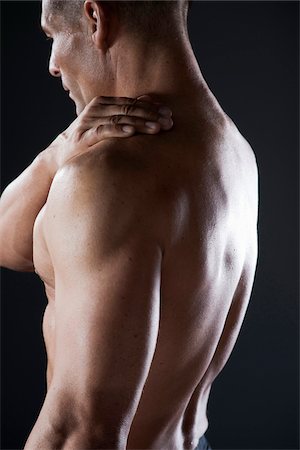Close-up of Man's Back, Studio Shot Photographie de stock - Premium Libres de Droits, Code: 600-06841743