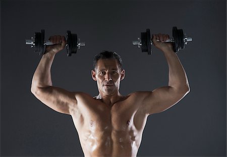 Muscular Man Lifting Weights, Studio Shot Photographie de stock - Premium Libres de Droits, Code: 600-06841756