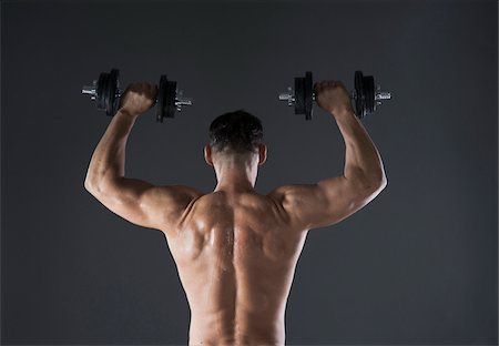 sweaty - Muscular Man Lifting Weights, Studio Shot Stock Photo - Premium Royalty-Free, Code: 600-06841758