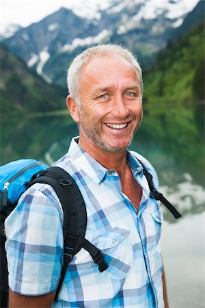 Portrait of mature man hiking at Lake Vilsalpsee, Tannheim Valley, Austria Stock Photo - Premium Royalty-Free, Code: 600-06841944