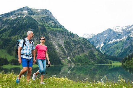 simsearch:600-05947909,k - Mature couple hiking in mountains, Lake Vilsalpsee, Tannheim Valley, Austria Stock Photo - Premium Royalty-Free, Code: 600-06841945