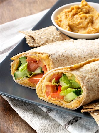 dipping sauce - Vegetarian Hummus Wraps Served on Platter with Hummus Dip and Crackers Stock Photo - Premium Royalty-Free, Code: 600-06895072
