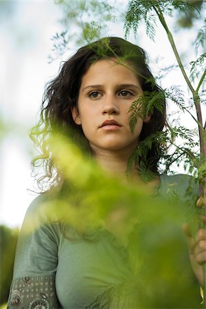 simsearch:600-07278927,k - Portrait of teenaged girl outdoors in nature, looking into the distance, Germany Stock Photo - Premium Royalty-Free, Code: 600-06899831