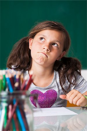 photos preteen school girls - Portrait of girl sitting at desk in classroom, Germany Stock Photo - Premium Royalty-Free, Code: 600-06899891