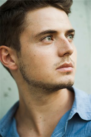 simsearch:700-06962074,k - Close-up portrait of young man outdoors, Germany Stock Photo - Premium Royalty-Free, Code: 600-06899997