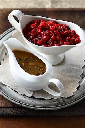 picture of a feast - Two Gravy Boats filled with Mushroom Gravy and Cranberries for Thanksgiving Meal, Studio Shot Foto de stock - Sin royalties Premium, Código: 600-06892692