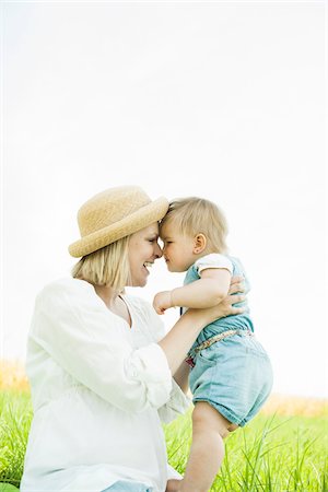 person rubbing nose - Mother and Baby Daughter Outdoors, Mannheim, Baden-Wurttemberg, Germany Stock Photo - Premium Royalty-Free, Code: 600-06892767