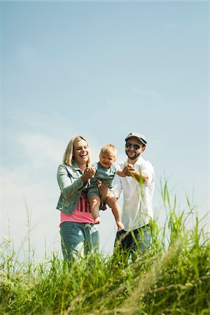 family happiness grass - Portrait of Family Outdoors, Mannheim, Baden-Wurttemberg, Germany Stock Photo - Premium Royalty-Free, Code: 600-06892789