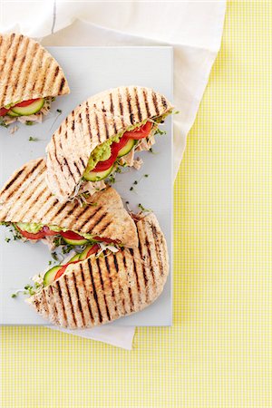 Overhead View of Tuna, Avocado, Tomato and Sprout Pita Pocket Sandwiches, Studio Shot Stock Photo - Premium Royalty-Free, Code: 600-06935010