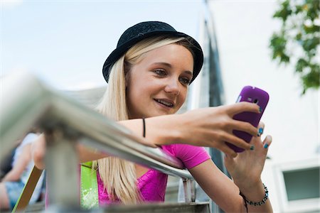 simsearch:600-06894854,k - Teenage Girl using Cell Phone Outdoors, Mannheim, Baden-Wurttemberg, Germany Stock Photo - Premium Royalty-Free, Code: 600-06939789