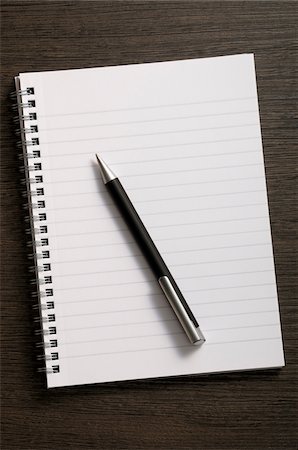 page - Close-up of blank notebook and writing pen on wooden background Stock Photo - Premium Royalty-Free, Code: 600-06961800