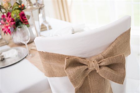 rustic wedding - Covered chair with sash and table setting for fine dining Stock Photo - Premium Royalty-Free, Code: 600-06961833